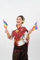 Portrait of Young woman in Thai Northeastern Traditional Clothing holding rainbow flag photo