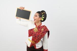 Portrait of Beautiful Thai Woman in Traditional Clothing Posing with blackboard photo