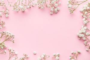White gypsophila flowers or baby's breath flowers  on pink  background. photo