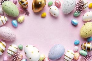 Happy Easter concept. Flat lay Easter eggs on  pink concrete background. photo