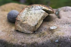 Beautiful composition of natural flat stone and small stones stacked together photo