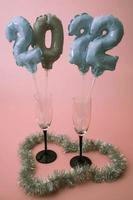 inflatable figures with the numbers 2022 in champagne glasses photo