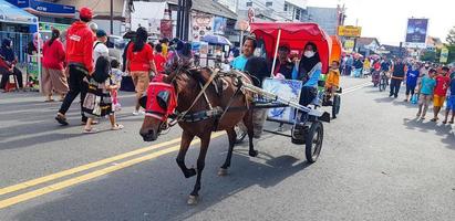 Surakarta, Indonesia, January 8, 2023 Dokar Wisata or chariot joyride in sunday car free day surakarta photo