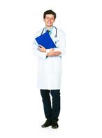 Full length portrait of a smiling male doctor holding a notepad on white photo