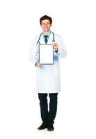 Full length young smiling male doctor showing clipboard with copy space for text on white photo