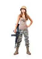 Soldier young beautiful girl dressed in a camouflage with a gun in his hand on white photo