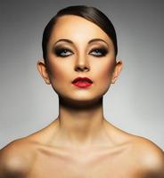 Portrait of a beautiful woman with a glamorous retro makeup photo