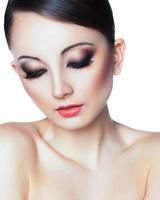 Portrait of a beautiful woman with a glamorous retro makeup photo