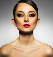 Portrait of a beautiful woman with a glamorous retro makeup photo