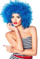 Portrait of a young beautiful girl with bright makeup in blue wig photo