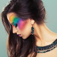 Portrait of a beautiful girl with a fashion bright multicolored makeup of eyes photo