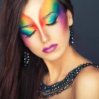 Portrait of a beautiful girl with a fashion bright multicolored makeup of eyes photo