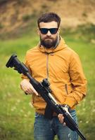 A man with an automatic rifle photo