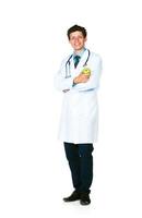 Portrait of a smiling male doctor holding green apple on white photo