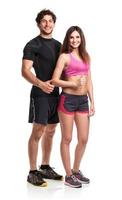 Athletic couple - man and woman with thumb up on the white photo