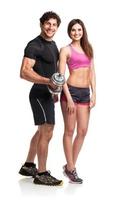 Athletic man and woman with dumbbells on the white background photo