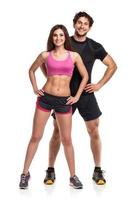 Athletic  man and woman after fitness exercise on the white background photo