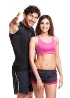 Athletic man and woman after fitness exercise on the white photo