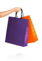 Two paper Shopping bags in woman hand photo