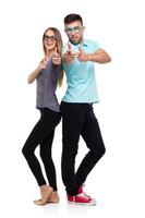 Happy couple smiling holding thumb up gesture, beautiful young man and woman smile looking at camera photo