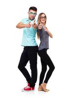Happy couple smiling holding thumb up gesture, beautiful young man and woman smile looking at camera on white photo