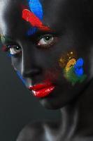 Portrait of a beautiful woman with black face photo