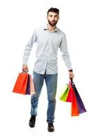 Handsome man holding shopping bags photo