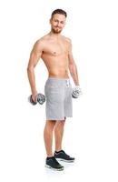 Athletic man with dumbbells on the white photo