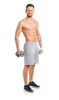 Sport man with dumbbells on the white photo