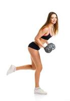 Happy athletic woman with dumbbells doing sport exercise, isolated on white photo