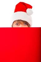 Christmas girl with red placard on white photo