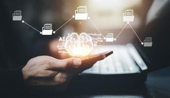 Hand hold smartphone with brain and Artificial Intelligence AI,on big data network machine learning and data on the dark background, artificial intelligence technology, innovation and futuristic. photo