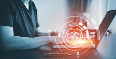 Hand Hacker touch laptop or smartphone and Touching in graph Screen code of a media screen on the White background, Technology Process System Business and hacks online concept, Copy space photo
