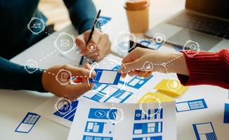 UX graphic designer planning application process development prototype wireframe for web smart phone. Creative digital development agency. photo