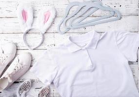 white polo shirt and bunny ears for mockup design photo