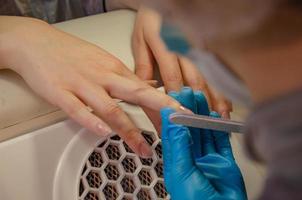 manicure, nails file with a file. photo