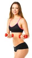 Happy athletic woman with dumbbells doing sport exercise, isolated on white photo