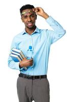 Happy african american college student standing with books and bottle of water in his hands on white photo