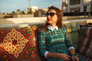Beautiful young woman resting in a cafe, Egypt photo