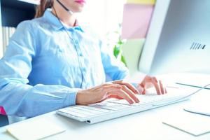 Close-up of woman working in a call center photo