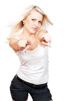 Young beautiful blonde girl pointing to you photo