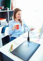 Beautiful business woman working at the home office photo