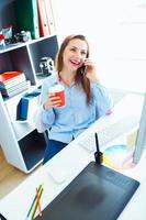 Beautiful business woman working at the home office photo