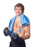 Young caucasian Man boxer with black boxing gloves. photo