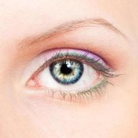 Eye with pink and green make-up photo