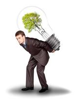 Businessman with eco lamp on back photo