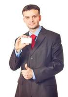 Businessman handing a blank business card photo