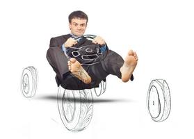 Businessman simulates driving a car photo