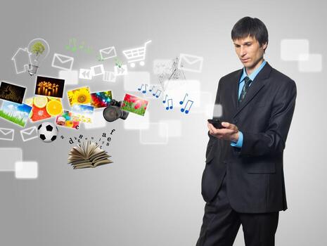 Businessman using touch screen mobile phone with streaming images photo