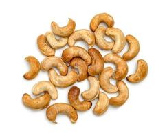 Roasted cashew nuts isolated on white background photo